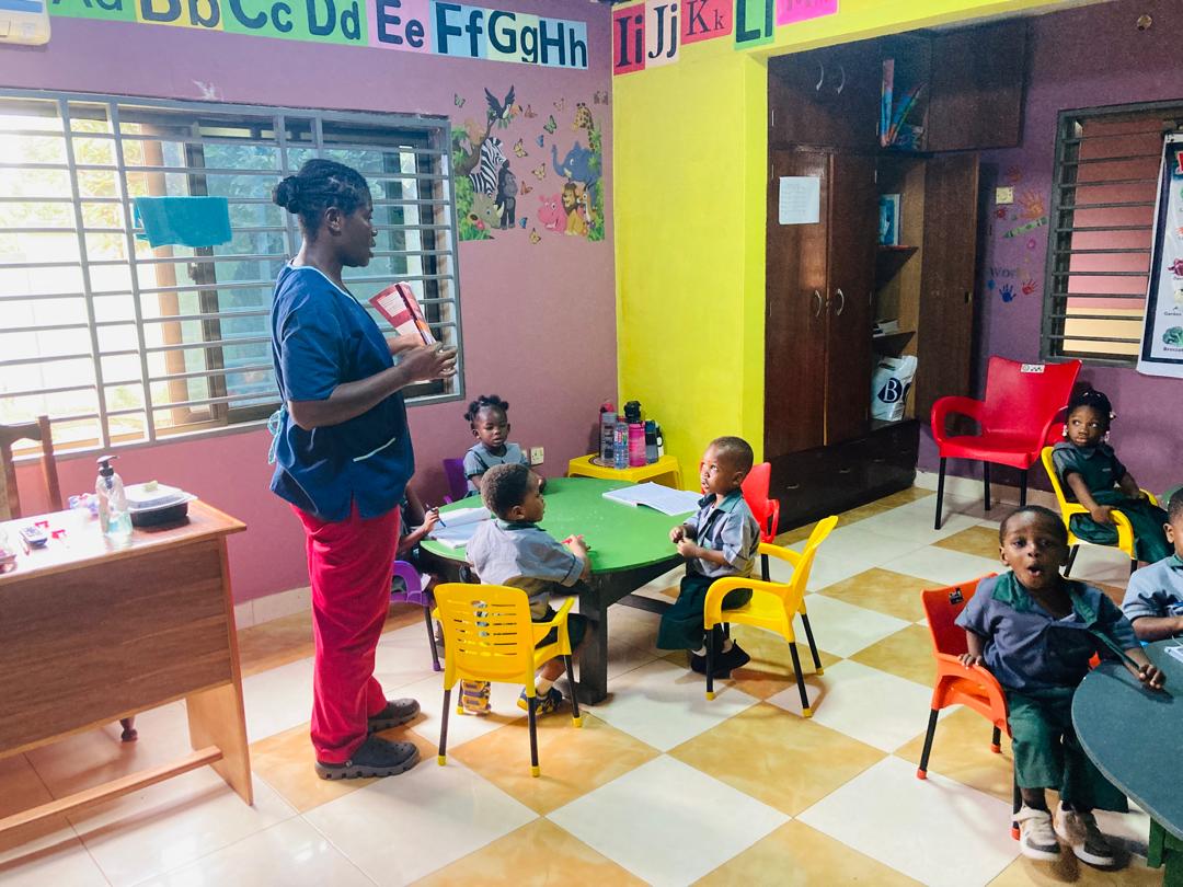 A Sunshine Valley teacher with children at their desks